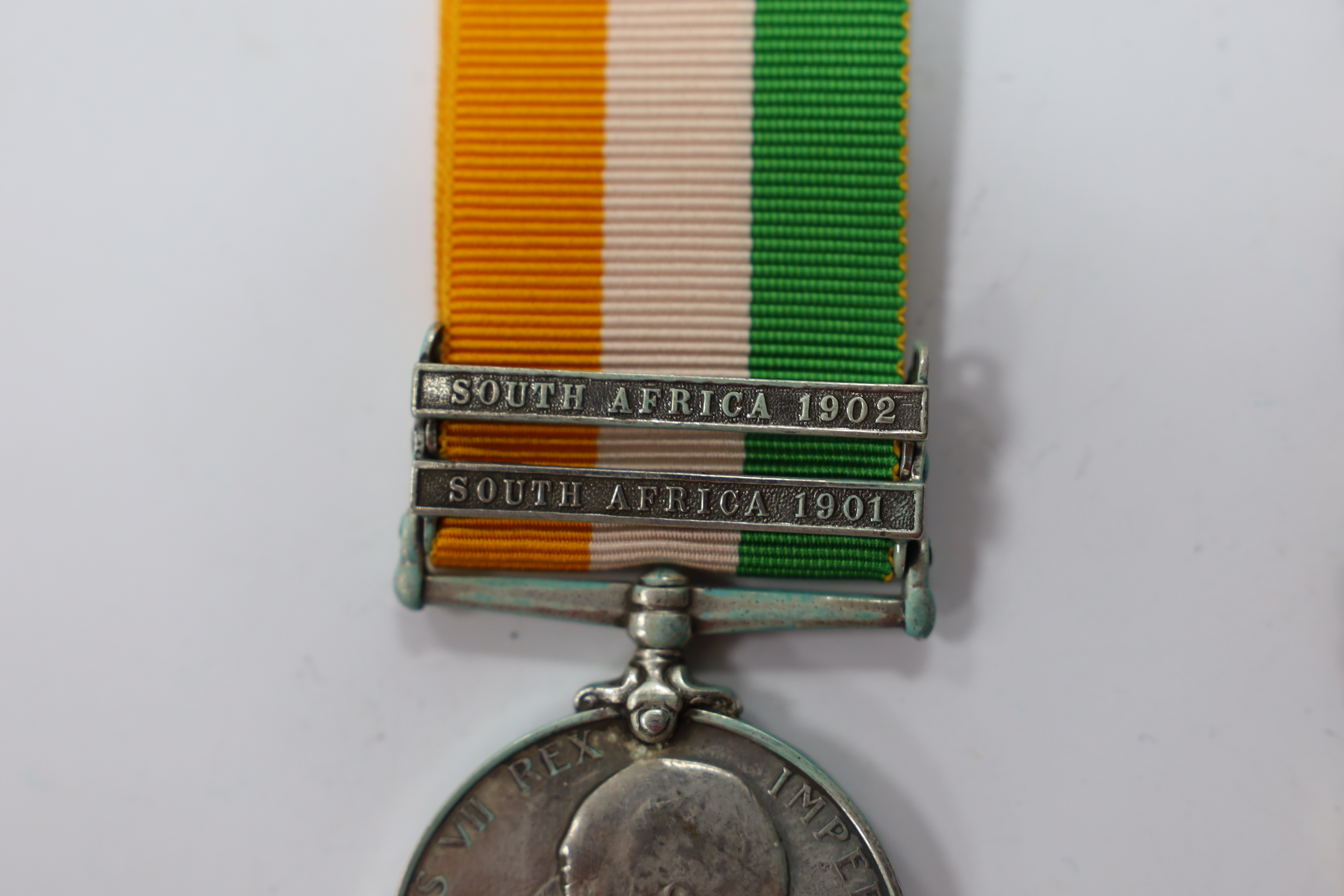 Assorted medals; two replica British North Borneo medals; Balaklava medallion; bronze GV medal; German China Campaign medal; bronze NRA medallion, unnamed